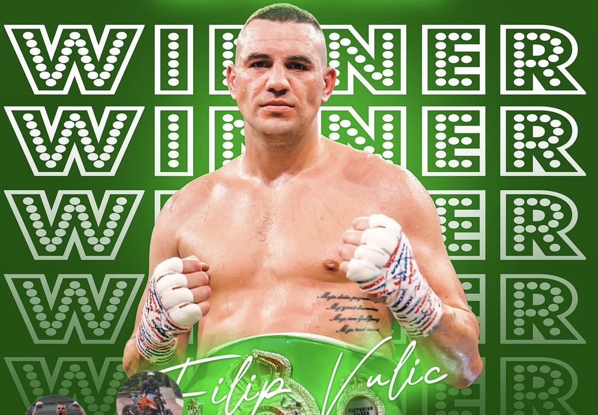 Filip Vulic posing with his championship belt